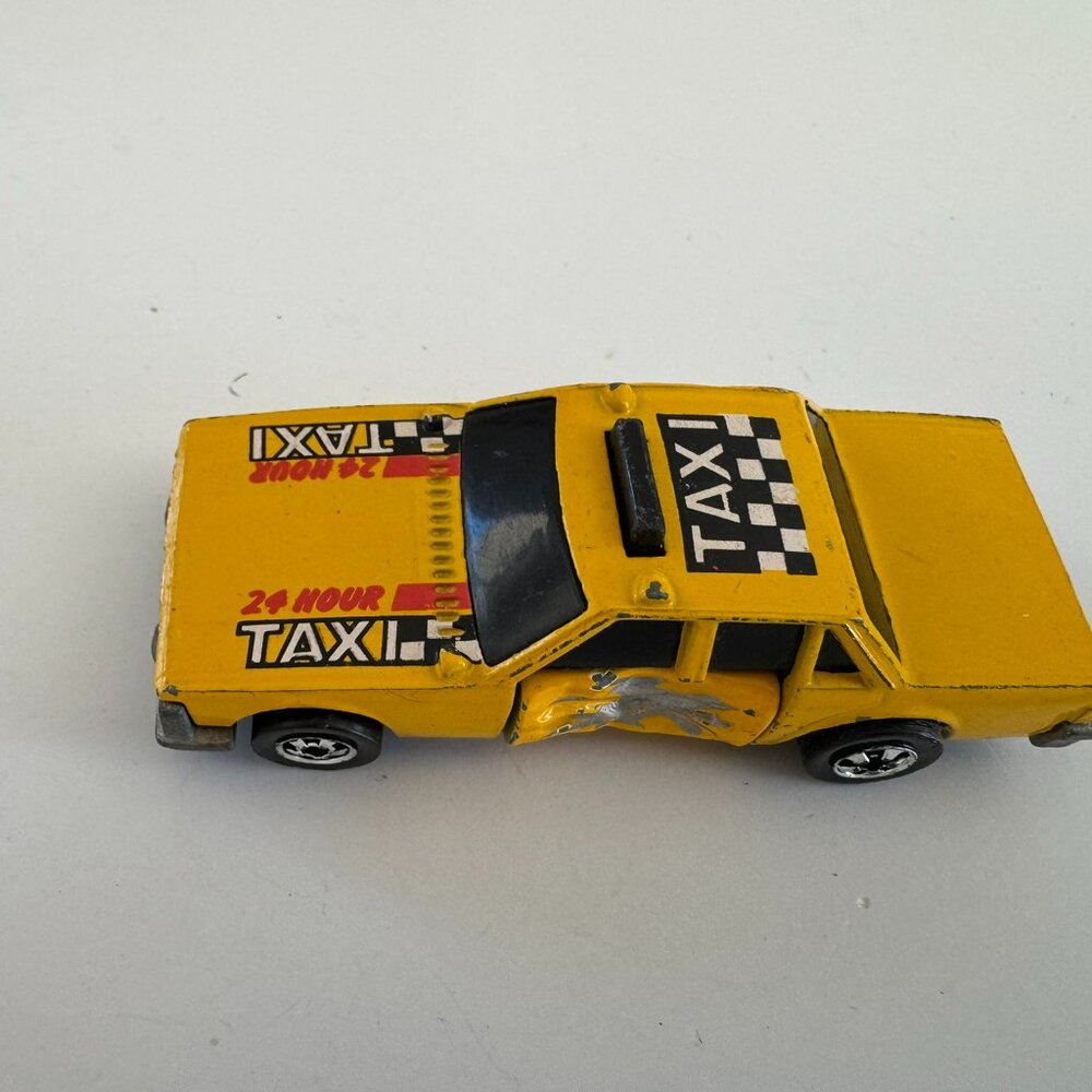 Lot 054 – Hot Wheels/Small Toys.  Sold As Is.  Yellow Crash Car